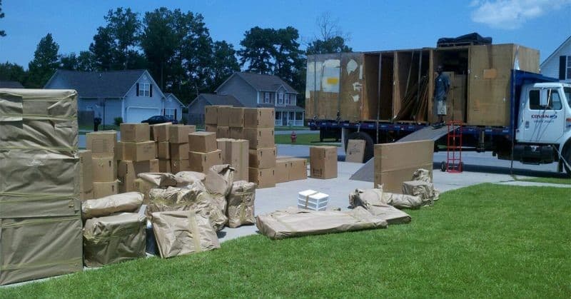 Moving truck with boxes on lawn